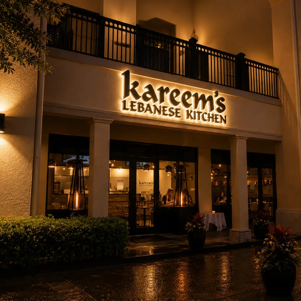 Nighttime exterior of Kareem's Lebanese Kitchen featuring illuminated signage, Mediterranean-inspired architecture, elegant lighting, and a welcoming upscale restaurant entrance.