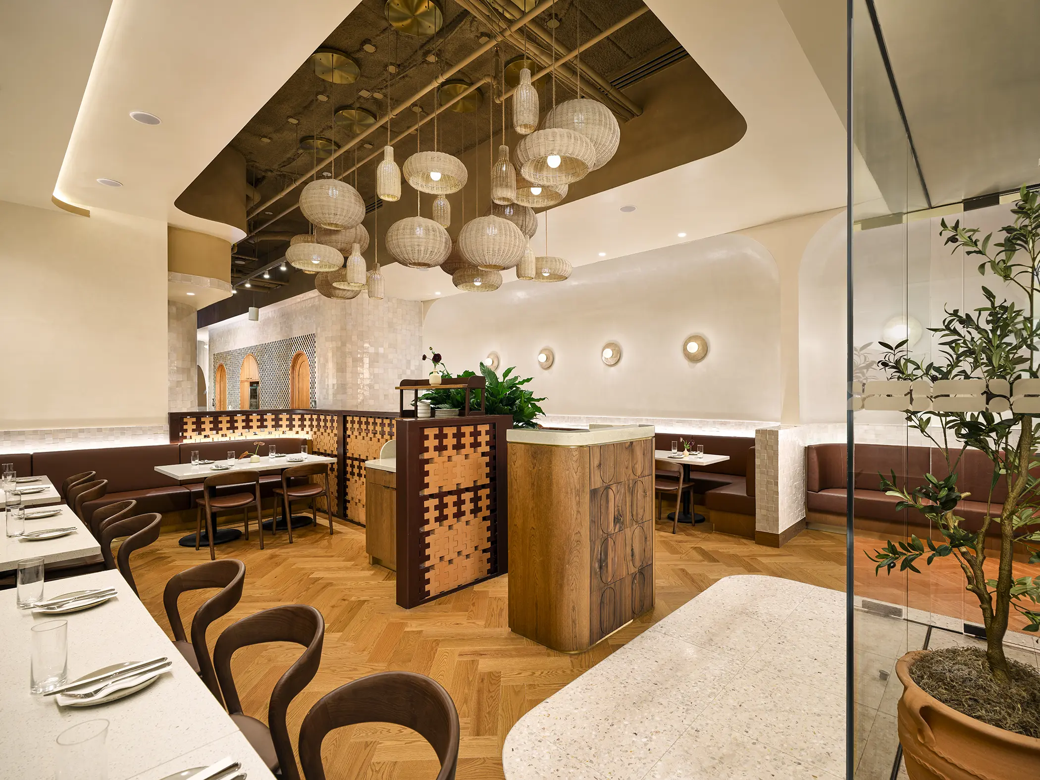 Dining and seating area inside Kareem’s Lebanese Kitchen featuring comfortable seating, warm lighting, and elegant décor.